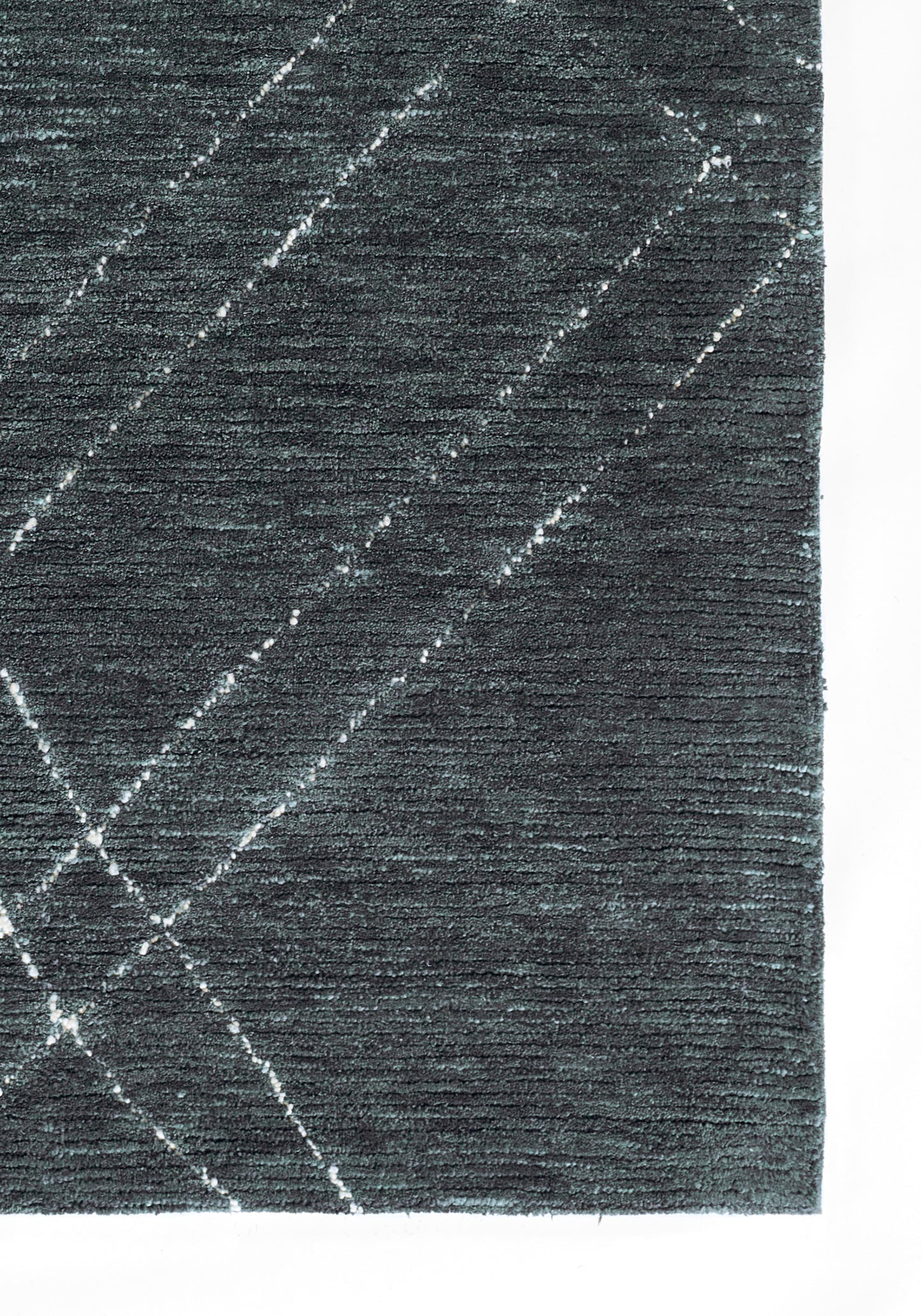 Textured dark blue rug with white diagonal lines creating a modern plaid pattern.