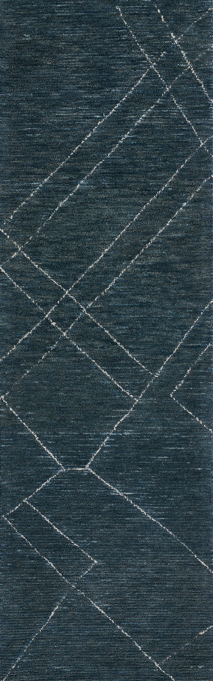 Blue textured rug with white intersecting diagonal lines forming a diamond pattern; modern geometric style.