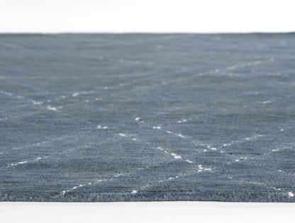 Blue textured runner rug with subtle white dashed lines; modern flatwoven style for living rooms
