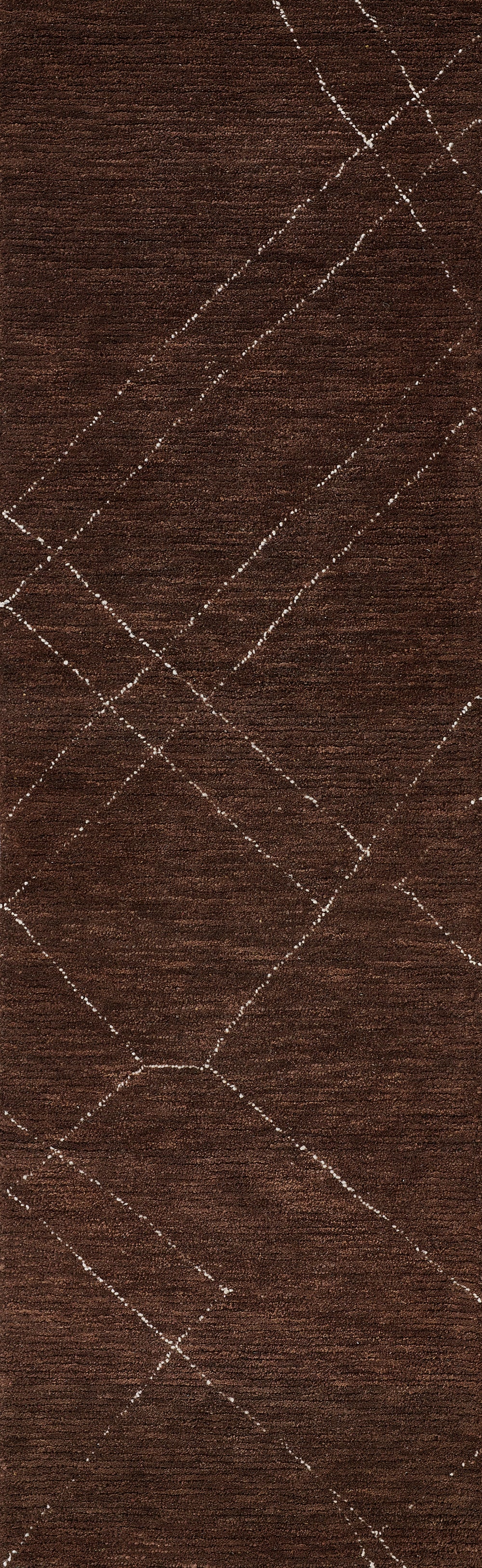 Dark brown rug with white diamond-stitched argyle pattern.