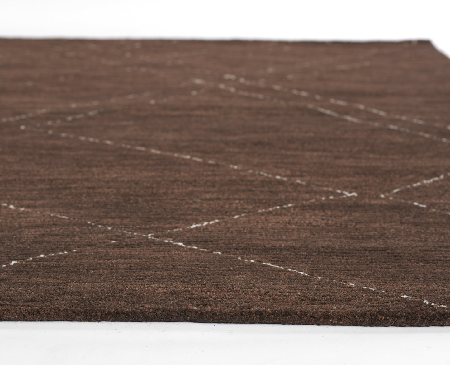 Brown textured area rug with white stitched diagonal diamond pattern, low-pile and soft underfoot.