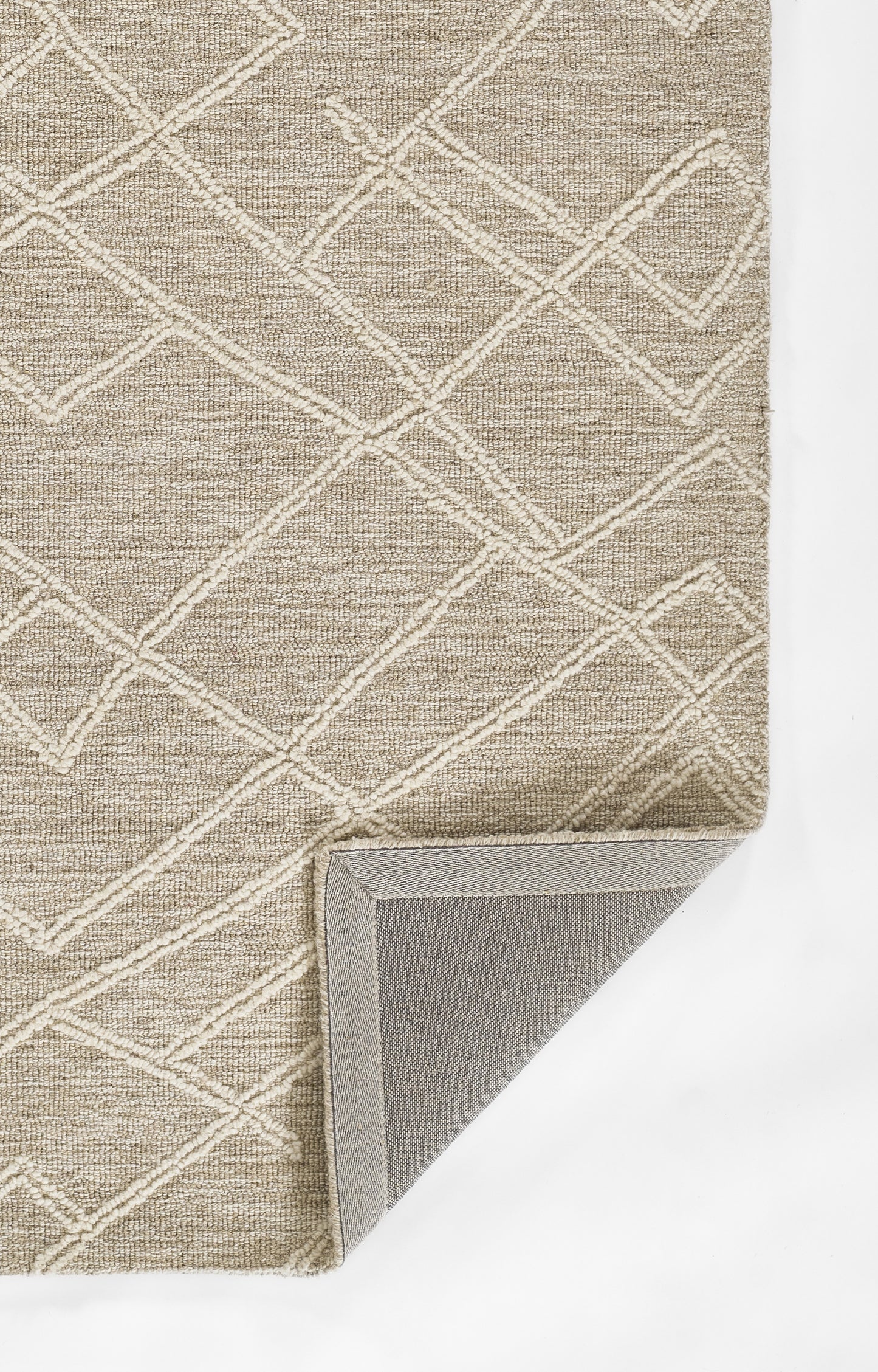 Beige woven area rug with a white diamond lattice pattern; rectangular with a folded corner revealing the gray backing.