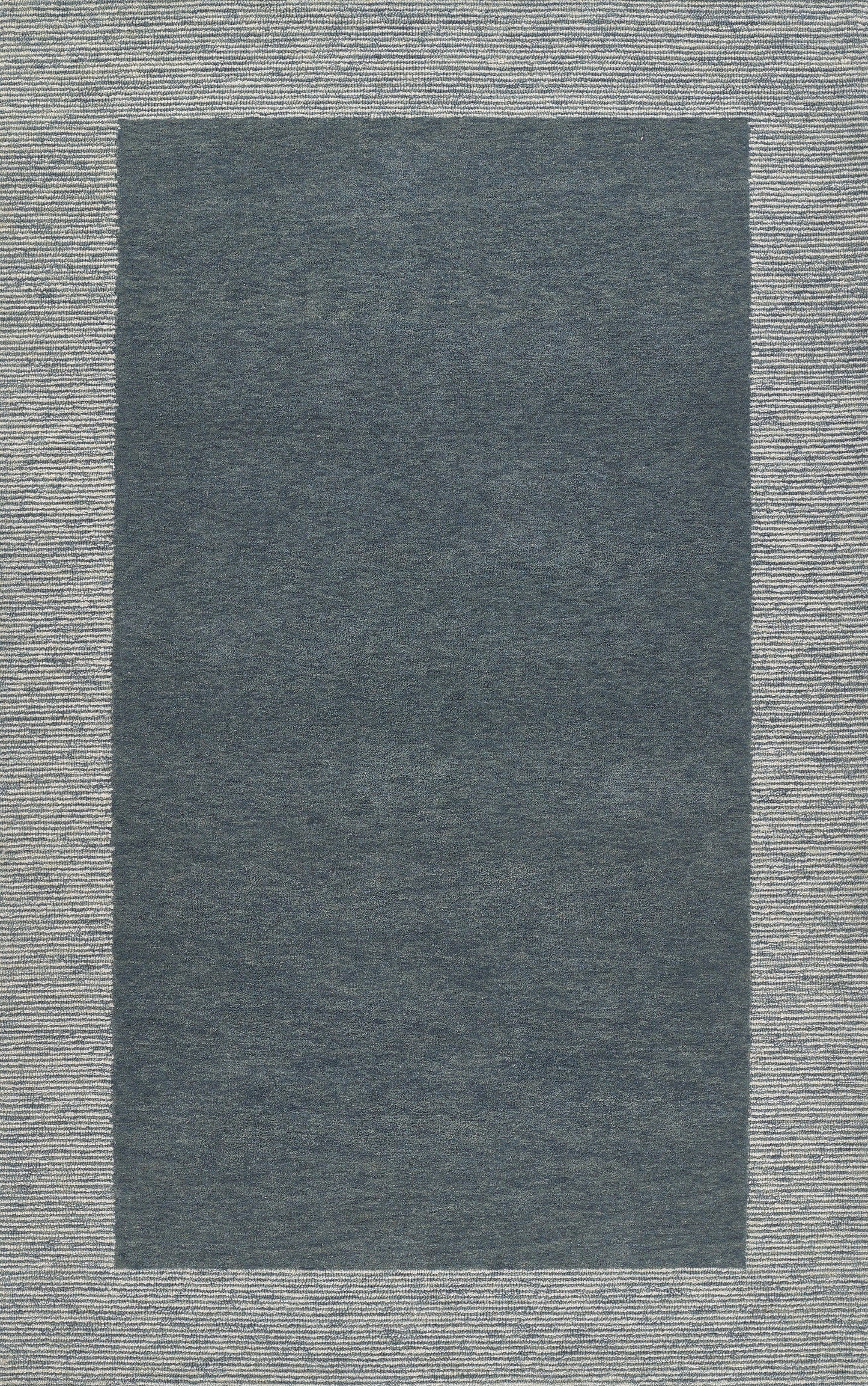 Rectangular blue-gray rug with a dark central panel and light woven border; modern minimalist living room rug.