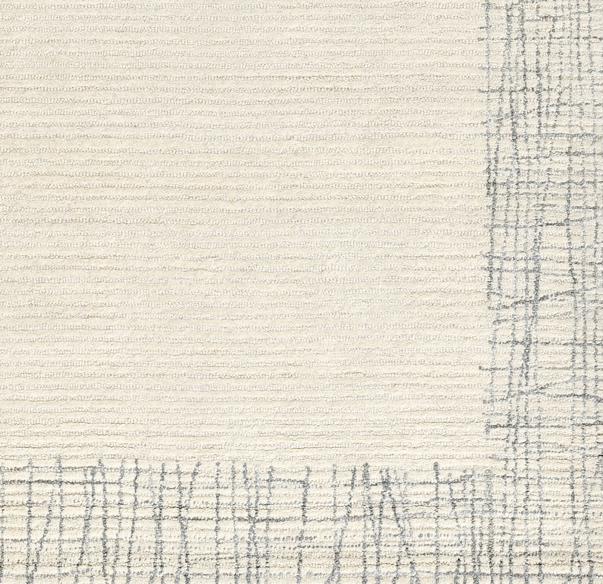 Cream textured rug with a gray plaid border along the bottom and right edges.