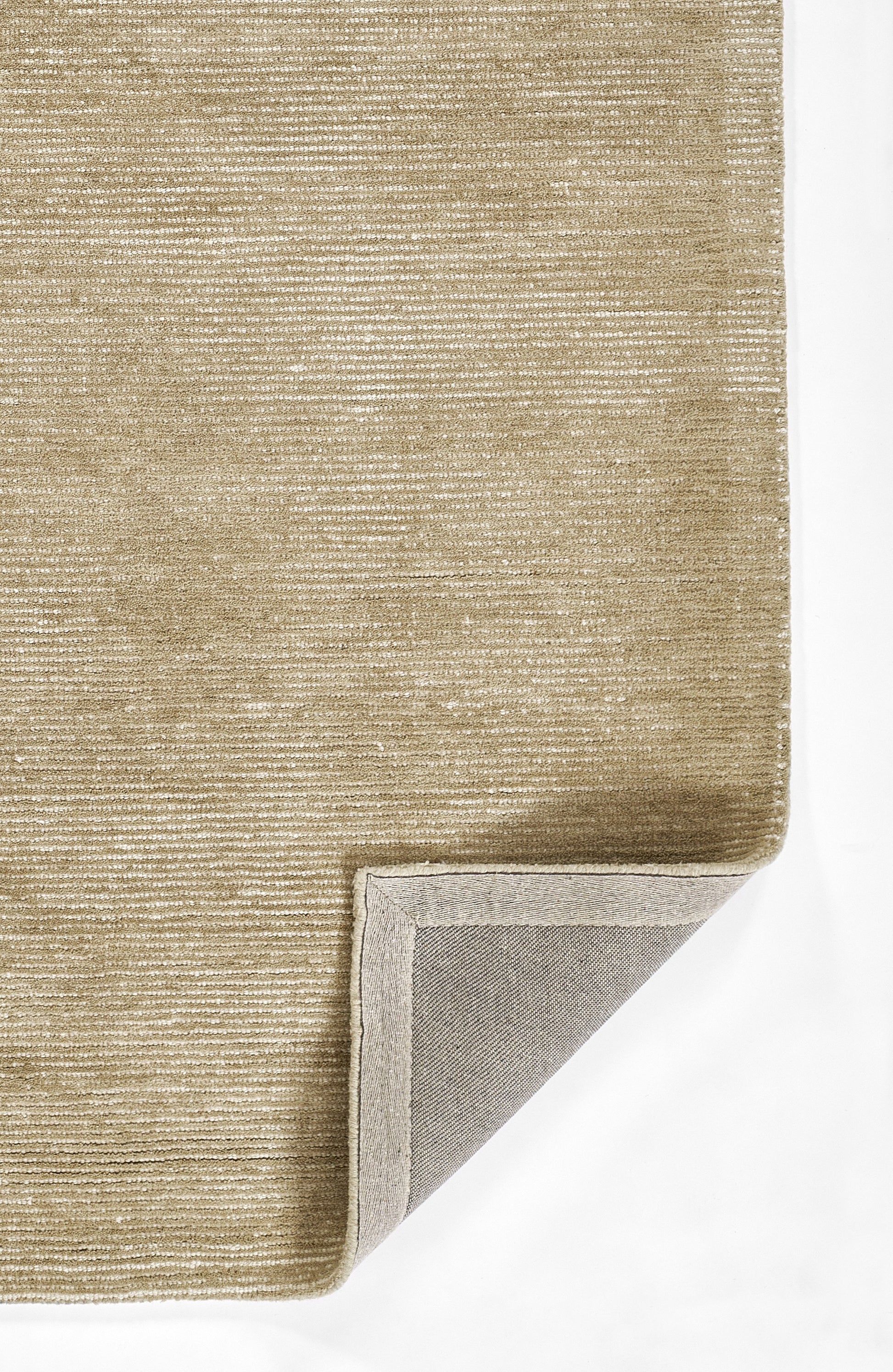 Taupe rug with subtle horizontal texture; corner folded to reveal light gray underside.