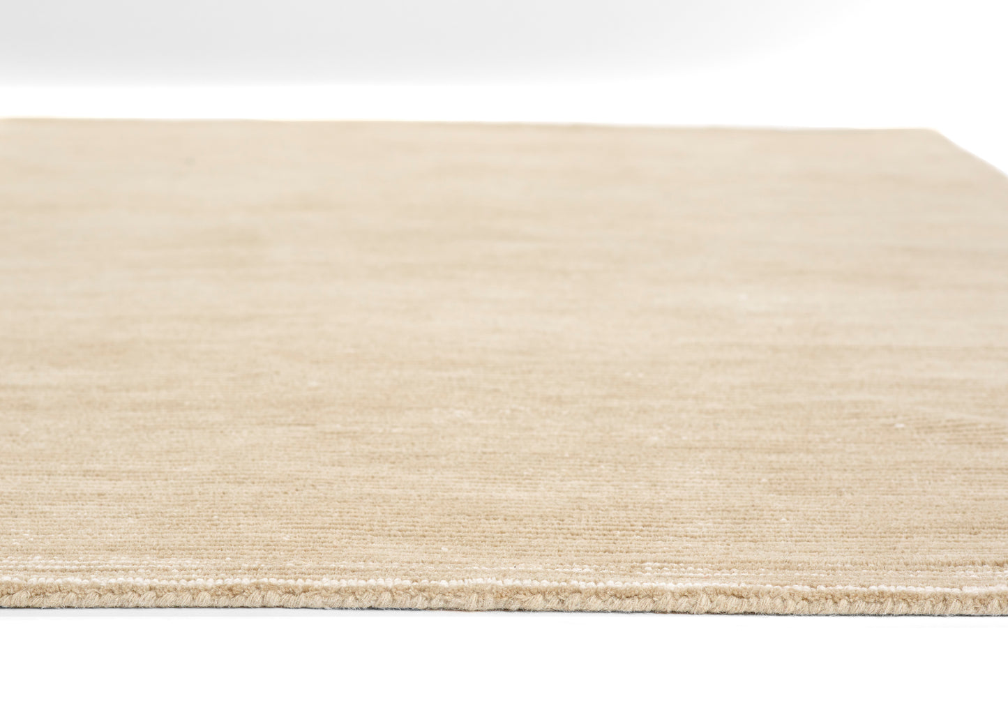Light-colored rug runner, close-up view emphasizing woven texture and edge, measures 2'3" x 8'.