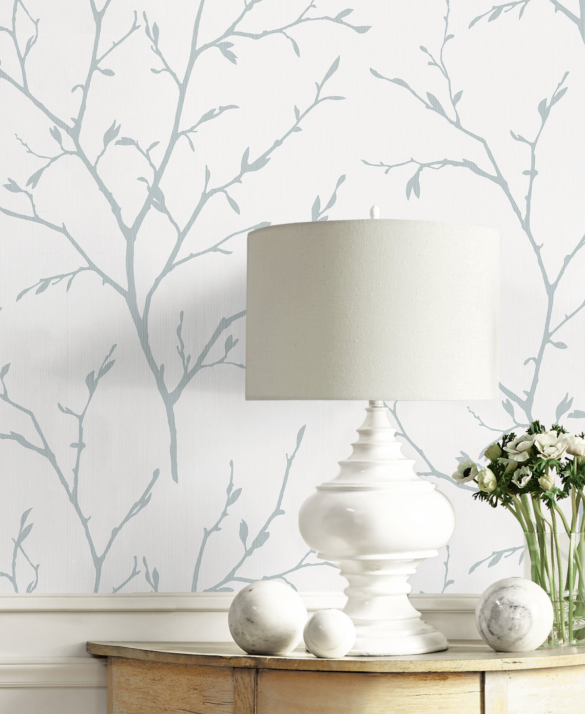 Blue satin wallpaper featuring a white heron branching botanical pattern.