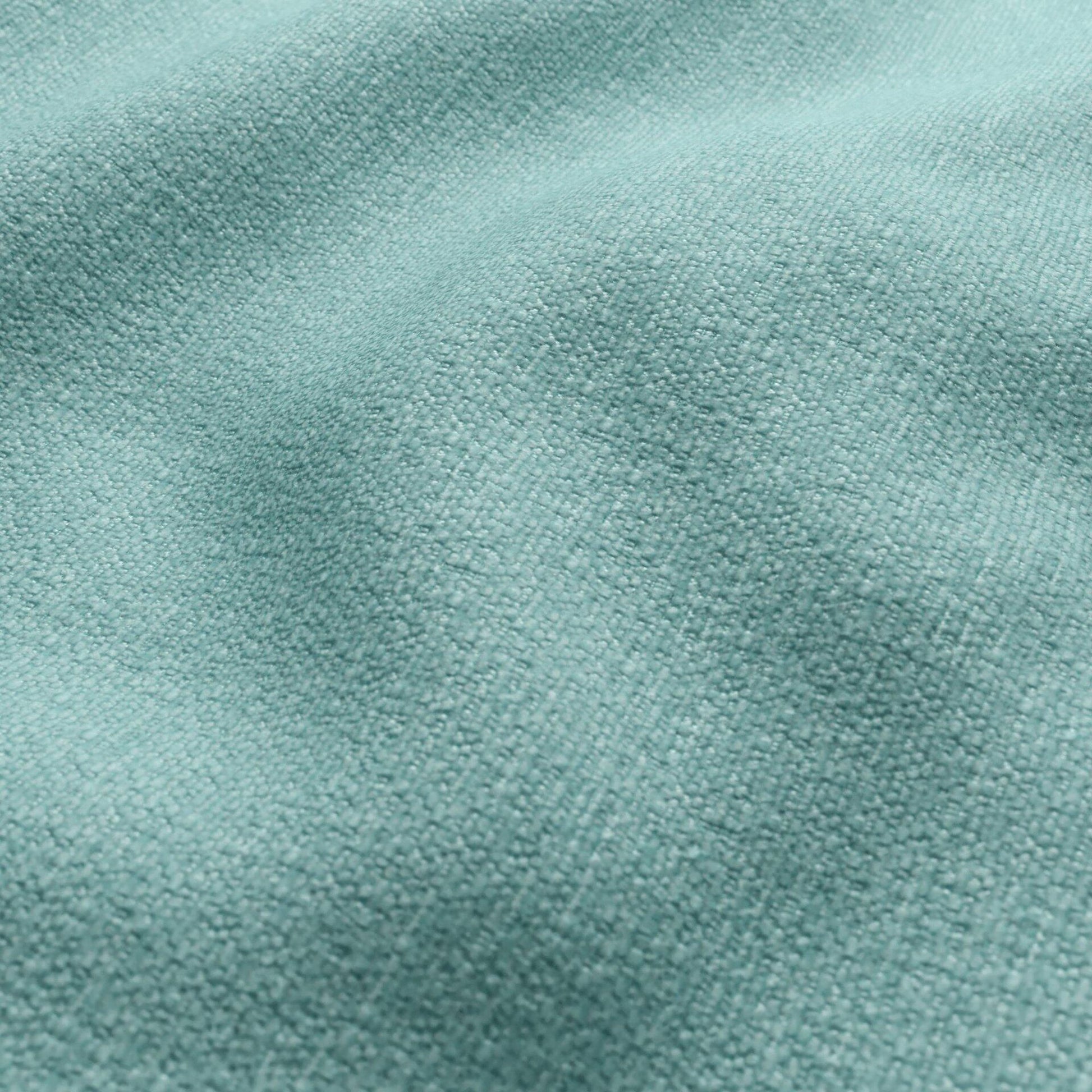 Aqua blue textured chenille fabric close-up, outdoor upholstery material.