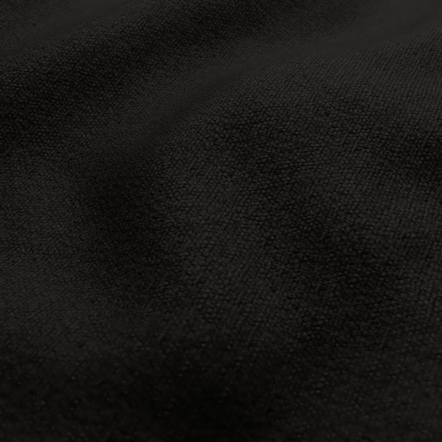 Close-up of black textured chenille outdoor fabric with a soft nap.