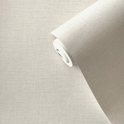 Cream lustre plain wallpaper roll, partially unrolled; smooth, unpatterned wallcovering.
