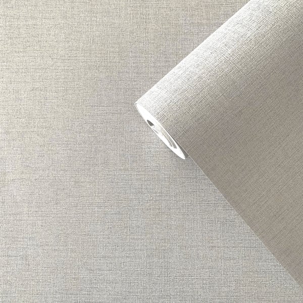 Beige linen-textured wallpaper roll partially unrolled, showing fabric-like grain.
