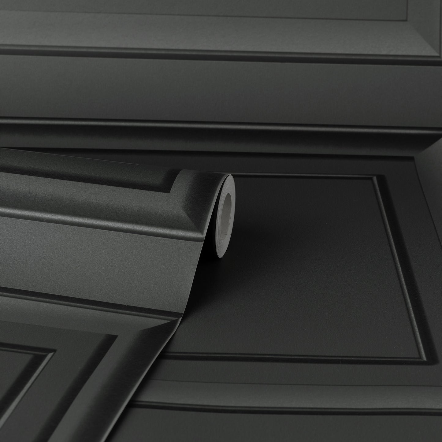 Close-up of a dark grey square panel wallpaper graphic with a subtle textured finish.