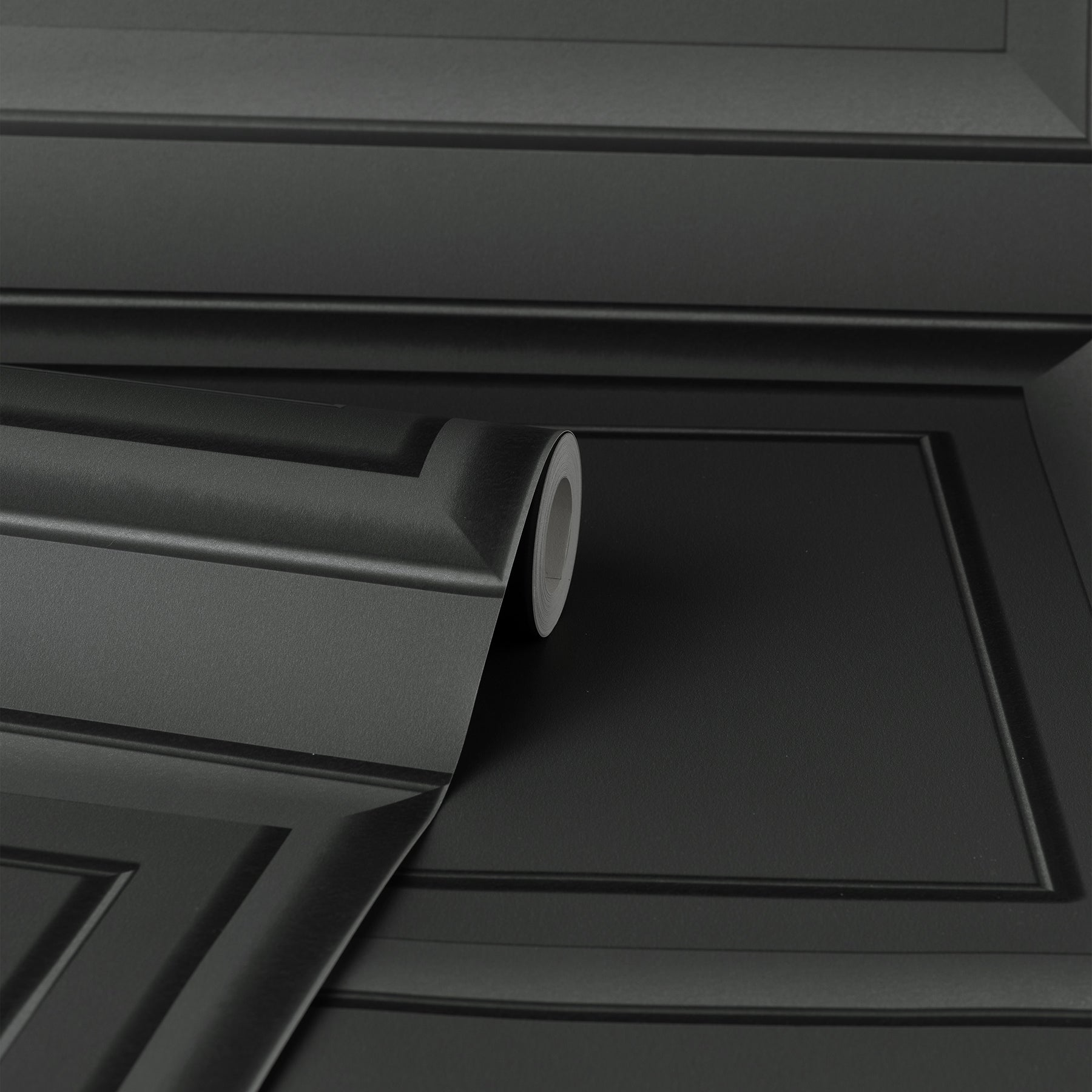 Close-up of a dark grey square panel wallpaper graphic with a subtle textured finish.