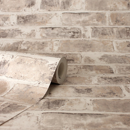Beige distressed brick-pattern wallpaper roll with taupe/gray tones for indoor walls.