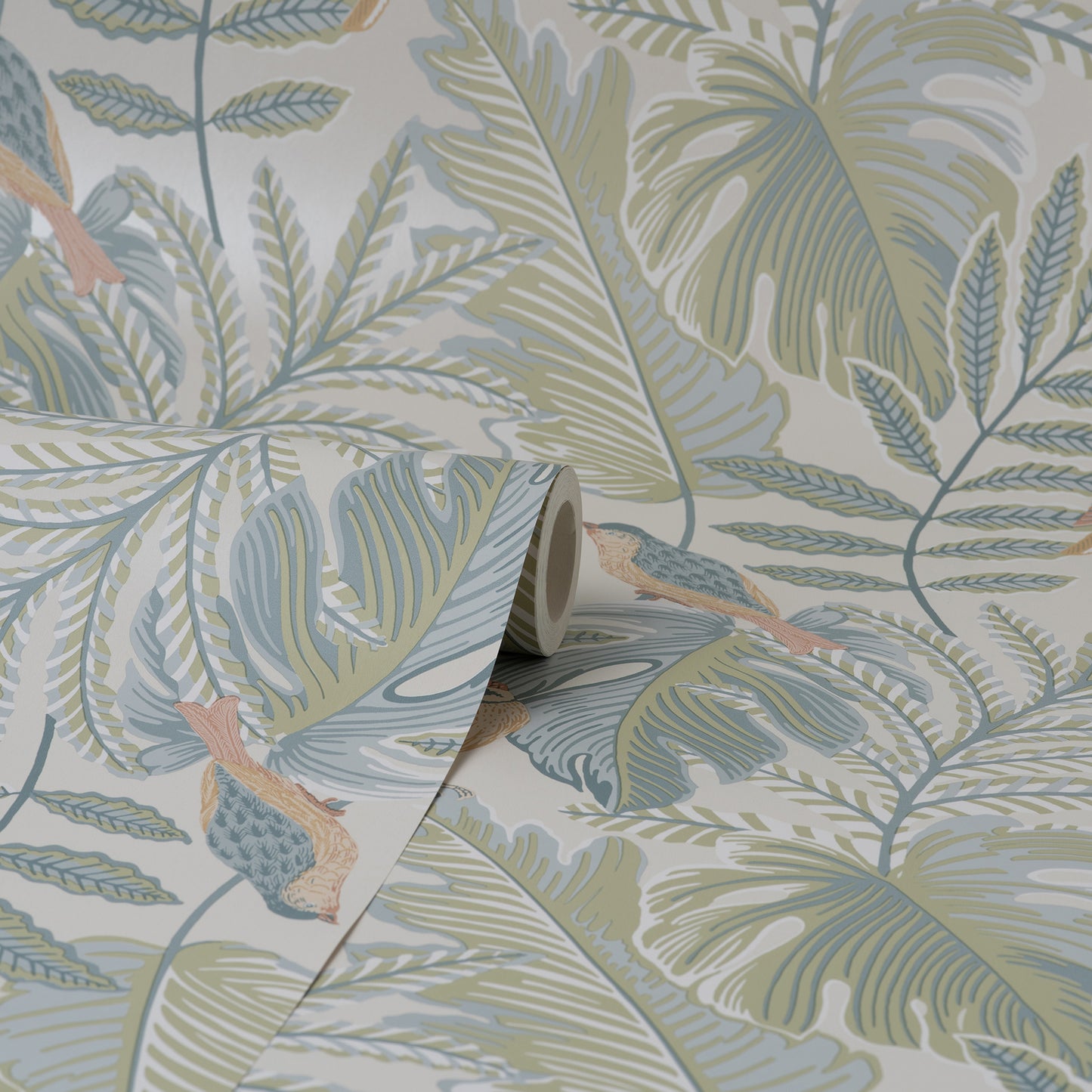 Rolled tropical wallpaper sample with pastel palm leaves and ferns, peach birds, in blue-green, sage and beige.