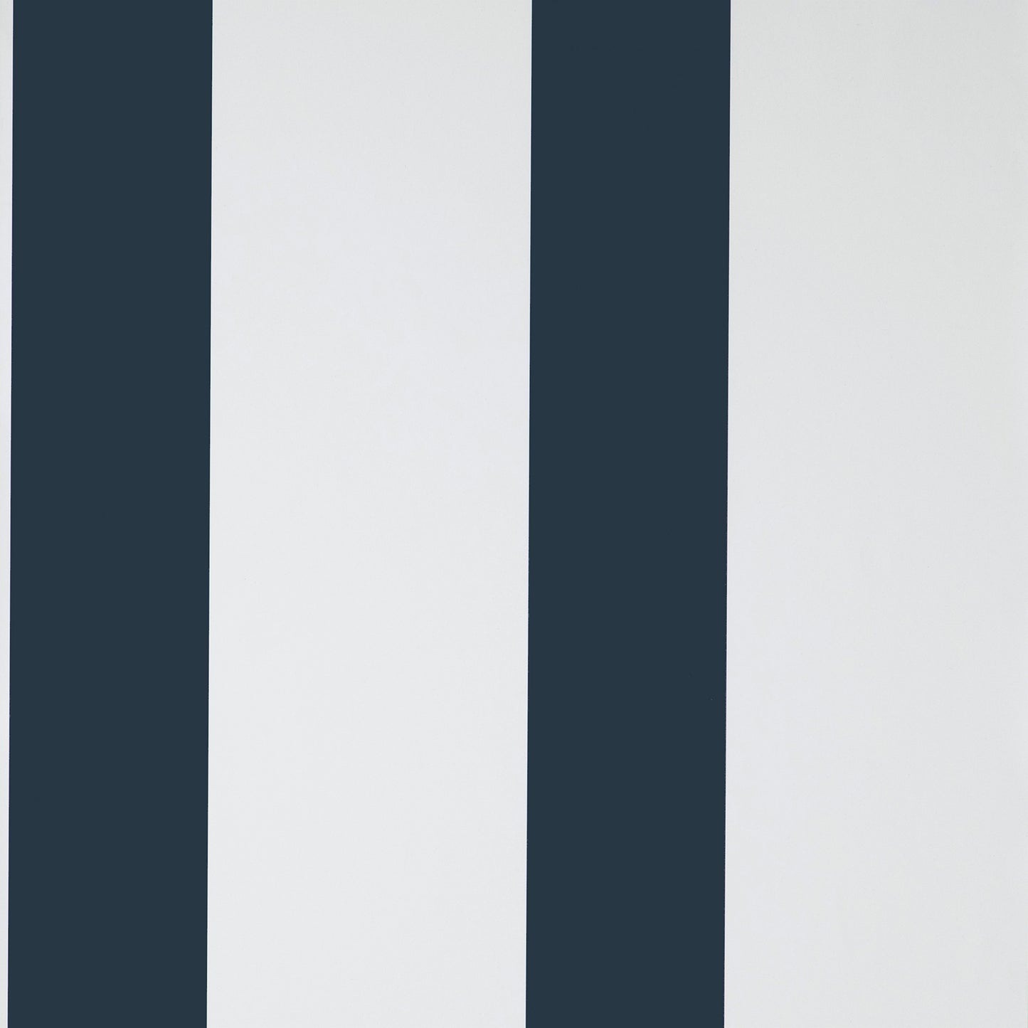 Vertical navy blue and white stripes on wallpaper; bold modern stripe pattern.