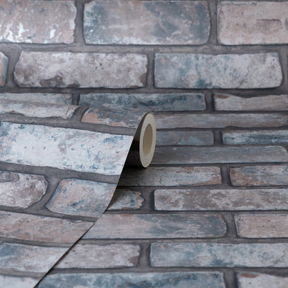 Roll of brick-pattern wallpaper in cool gray-blue tones, close-up view of textured masonry pattern.