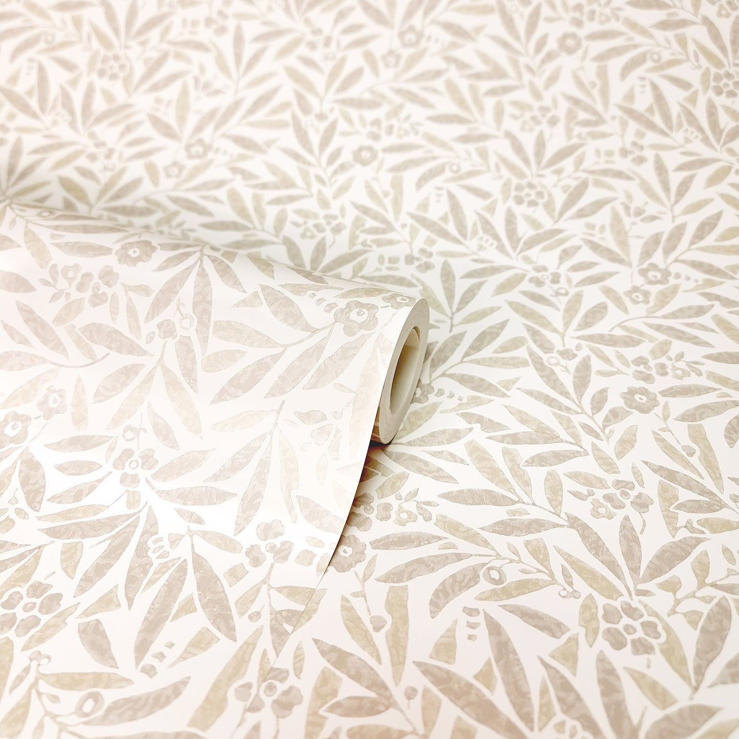 Cream wallpaper with beige botanical pattern of leaves and small flowers; rolled corner.