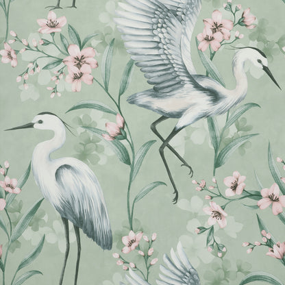 Pastel green wallpaper featuring white herons among pink blossoms and green leaves in a nature-inspired decorative pattern.