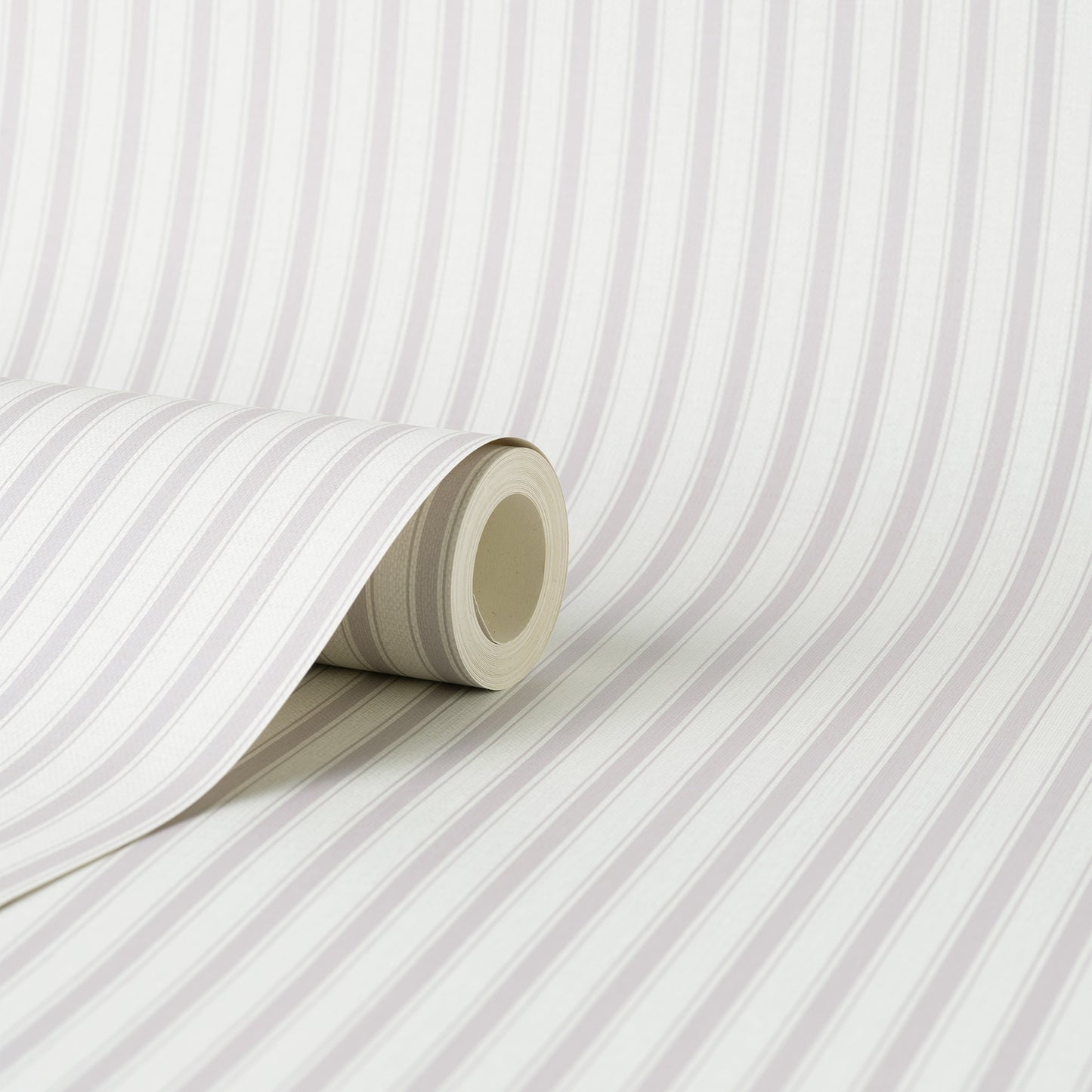 Close-up of a wallpaper roll showing lavender ticking stripe on a white and pale gray background, partly unrolled on a flat surface.