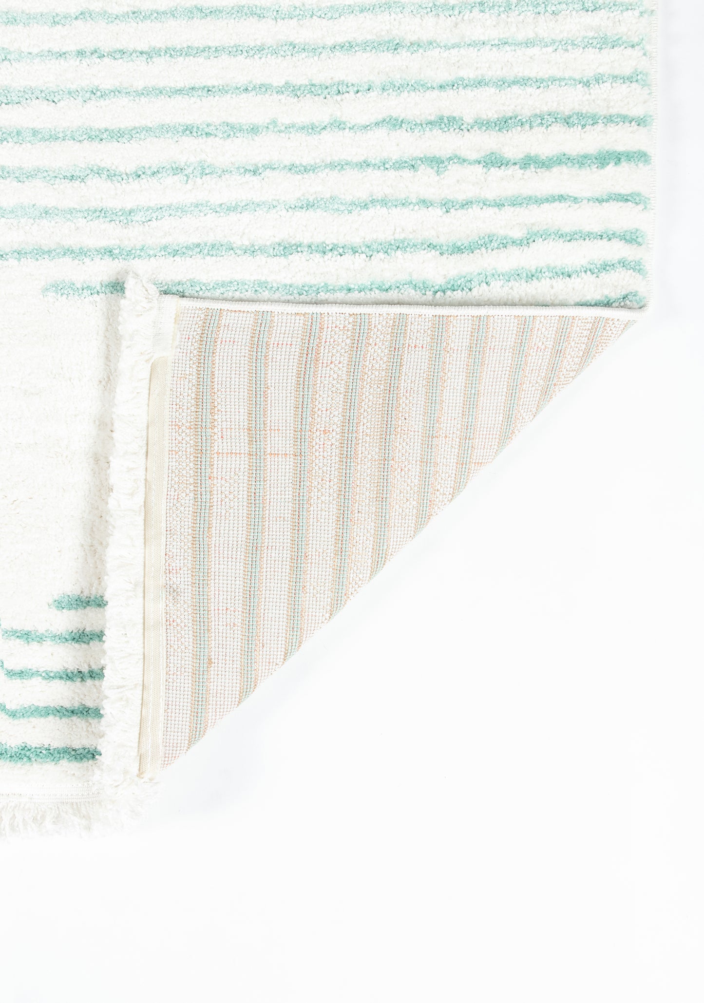 Aqua teal striped rug with soft pile; corner folded to reveal beige striped reverse.
