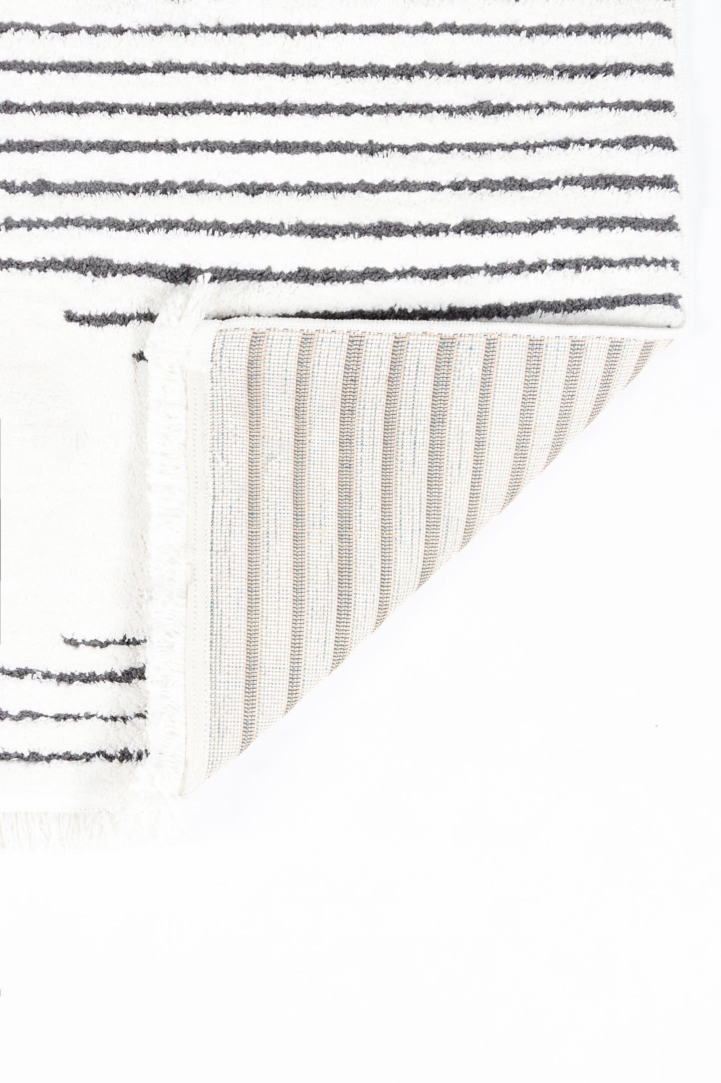 White rug with dark gray horizontal stripes and cream ribbed underside; rectangular cotton floor mat.