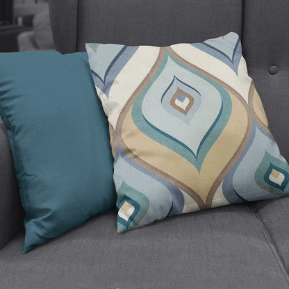 Teal solid throw pillow on a dark gray sofa.