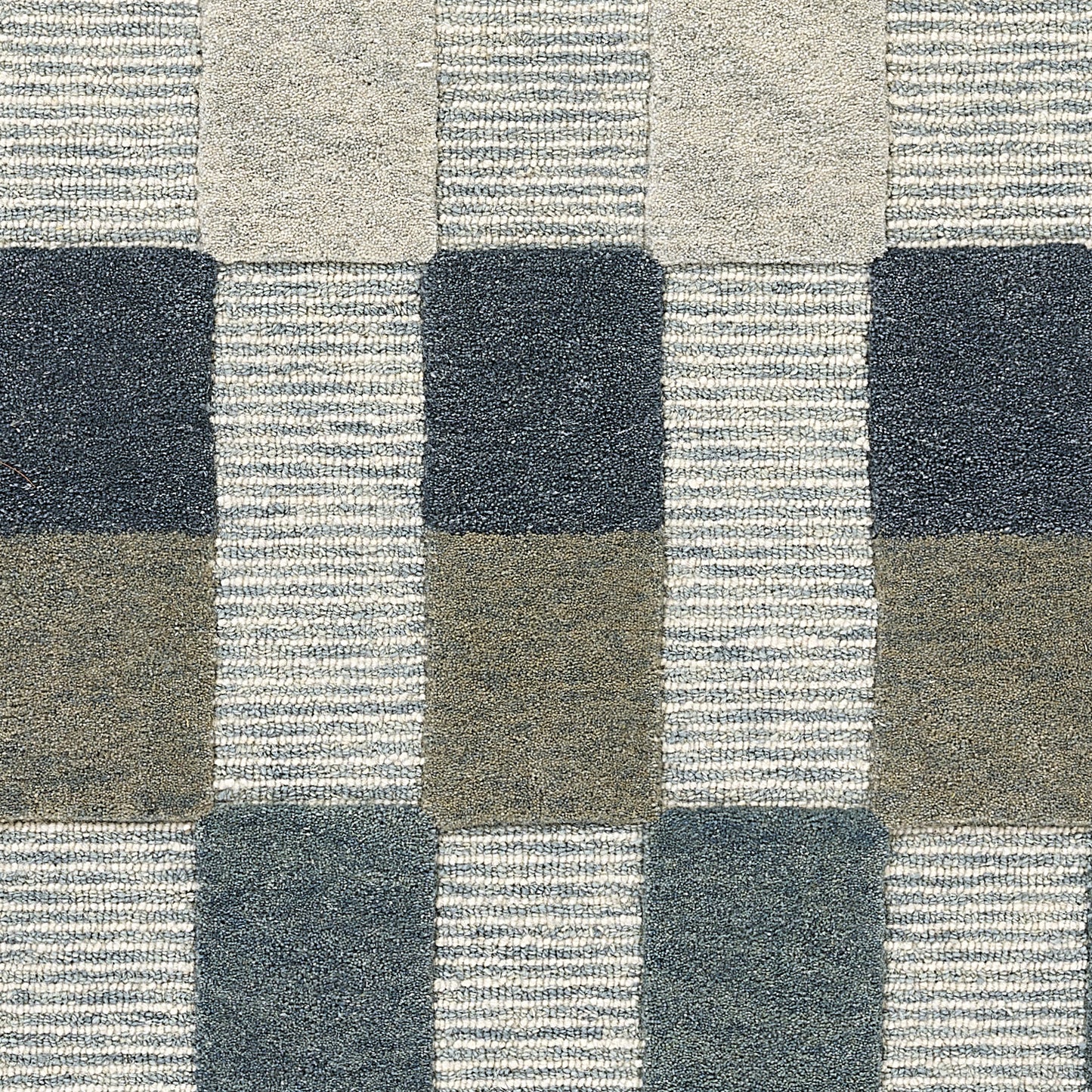 Navy, gray, and taupe woven checker-block rug, 9' x 12'.