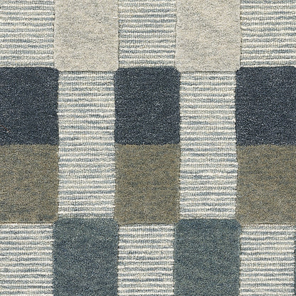 Blue-gray plaid fleece blanket with square blocks in navy, taupe and light gray; cozy throw.