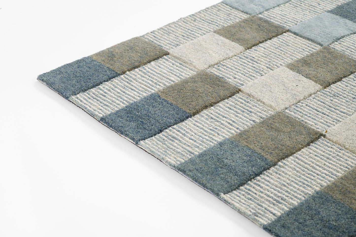 Rectangular rug with blue, gray, and beige checkerboard squares and striped textures.