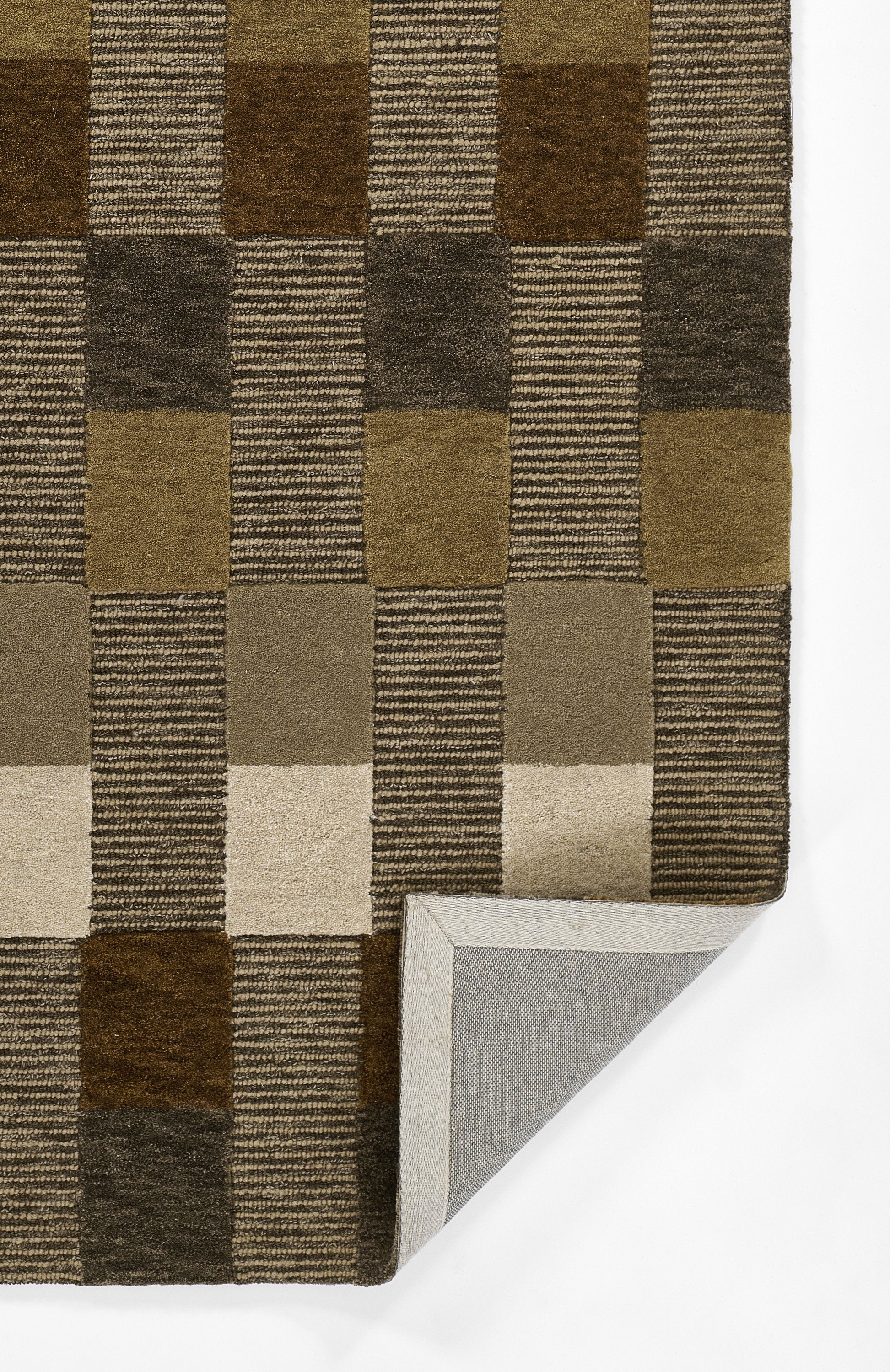 Checkerboard brown-tan area rug with striped blocks, flat-weave; folded corner shows grey backing.