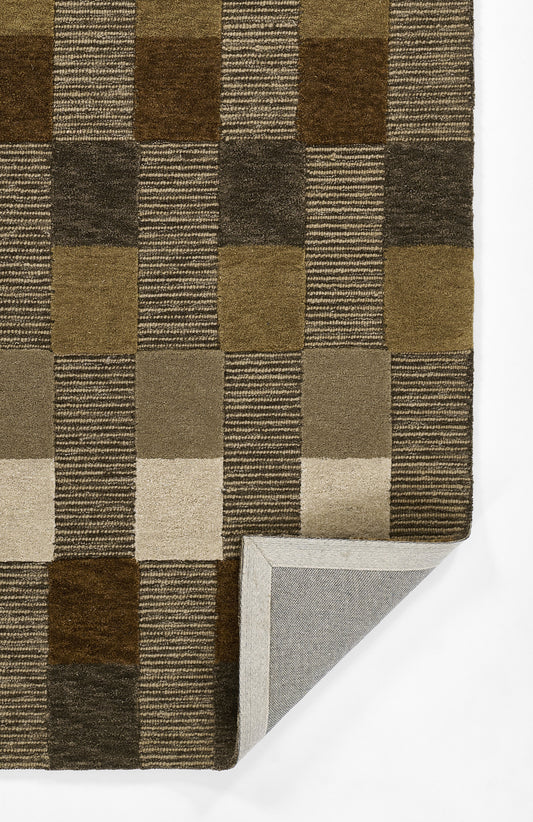 Geometric brown checkerboard rug with alternating solid & striped squares; warm earthy tones, woven texture, folded corner.