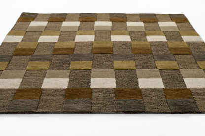 Patchwork brown beige rug with square blocks in varying shades; rectangular, modern geometric, plush textured