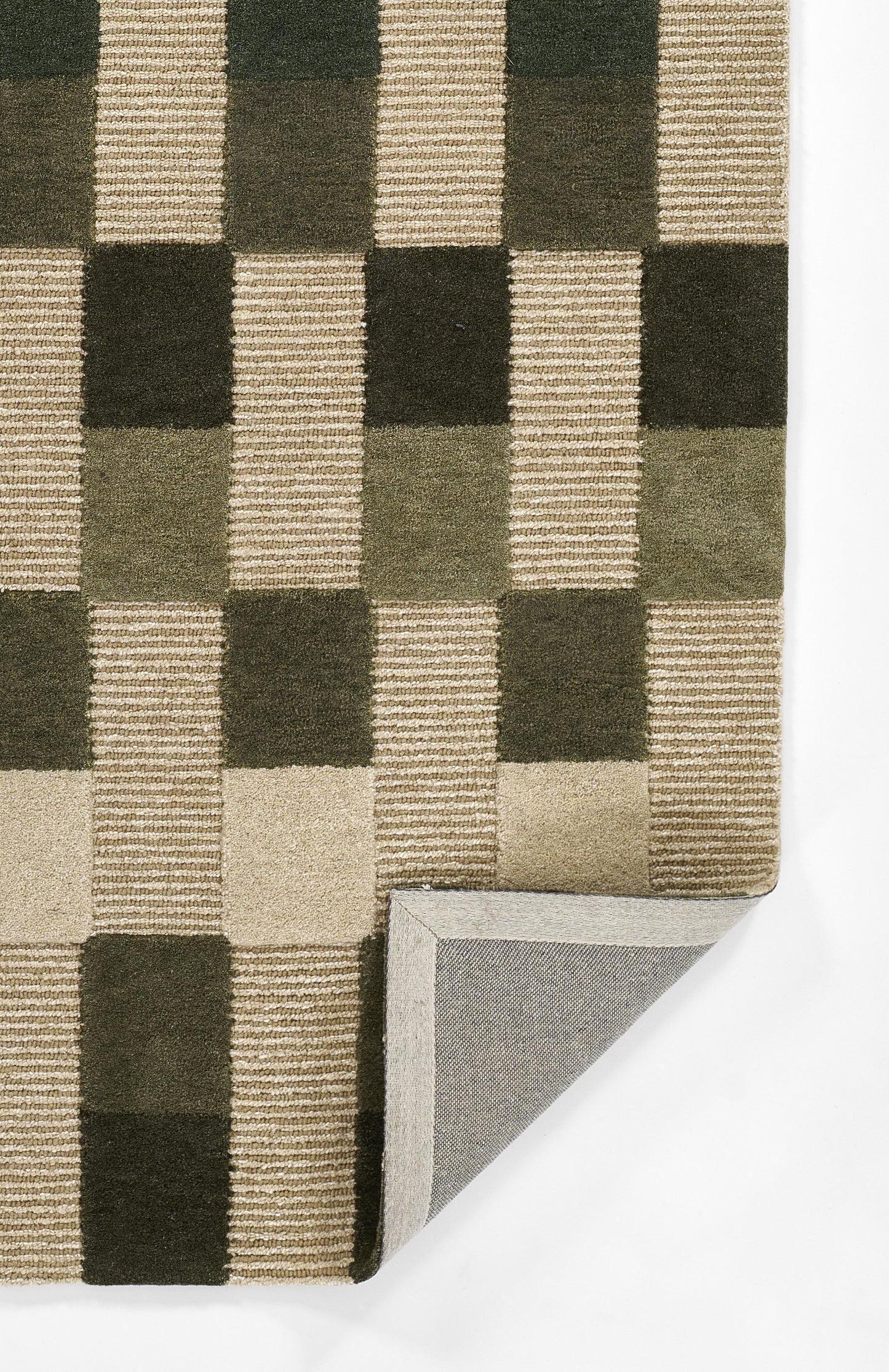 Rectangular rug in olive green and beige checkerboard with textured striped squares; corner folded to show gray backing.