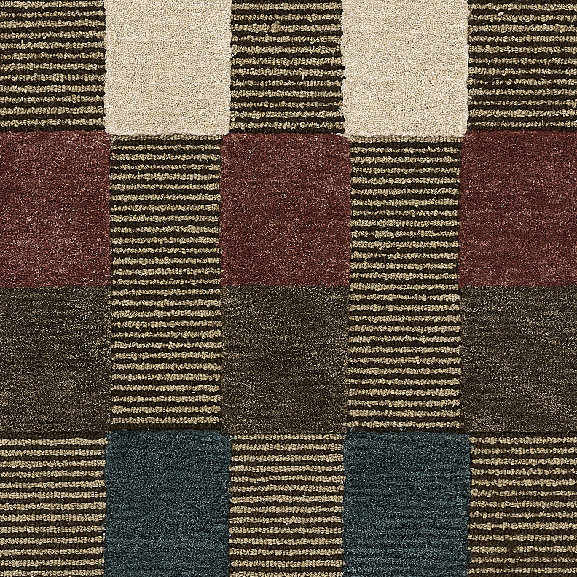 Geometric rug with alternating blocks of cream, beige, burgundy, brown & navy, featuring striped textures.