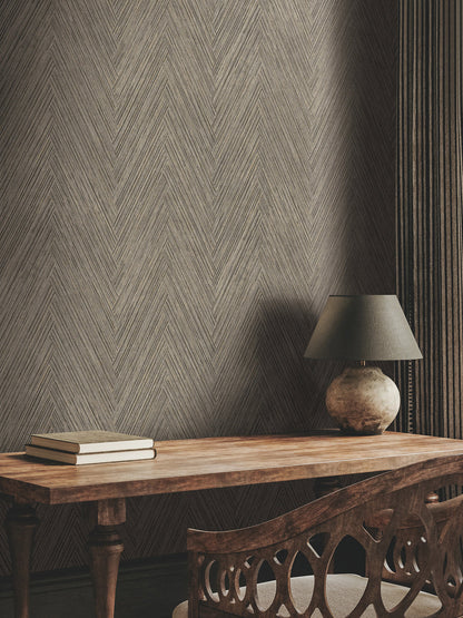 Charcoal textured chevron wallpaper with intricate woven lines, subtle black and gray tones, and delicate metallic gold accents creating a sophisticated herringbone-inspired pattern.