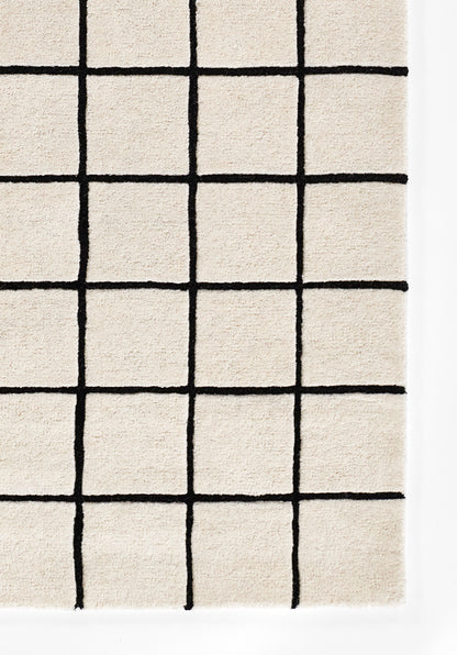 Beige woven rug, 5' x 8', with bold black grid lines forming a square geometric pattern; modern style.