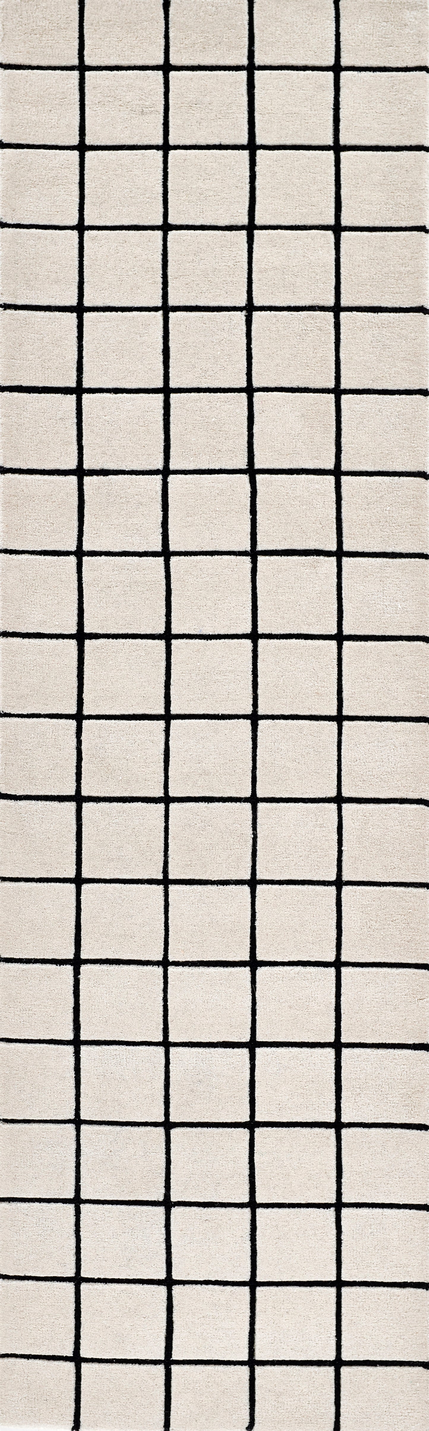 Beige rug with a bold black square grid pattern; modern minimalist design.