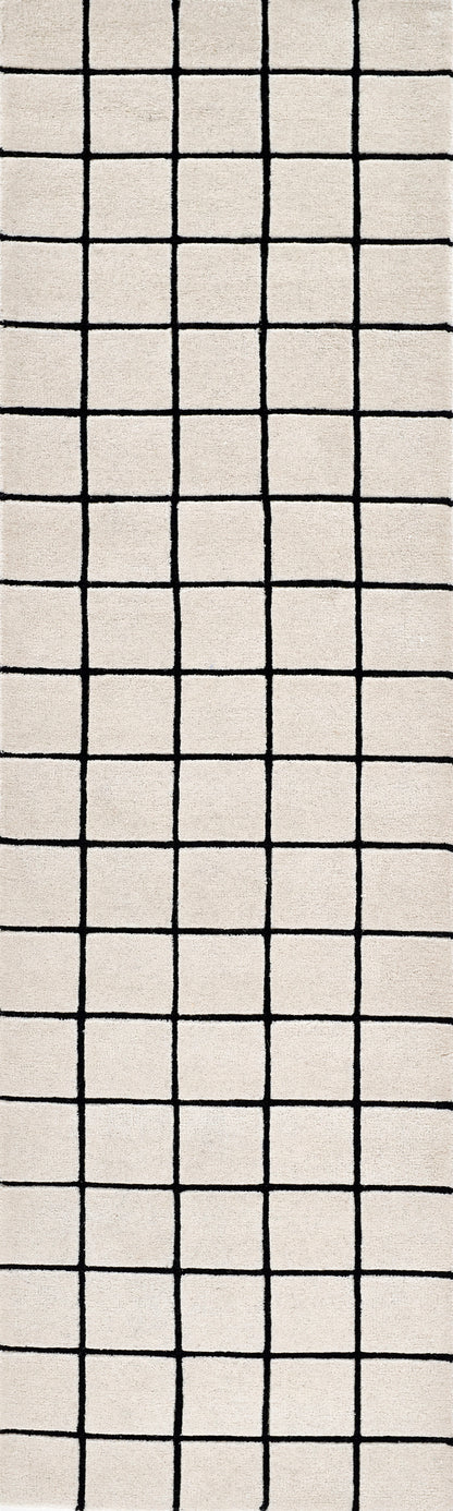 Beige rug with a bold black square grid pattern; modern minimalist design.