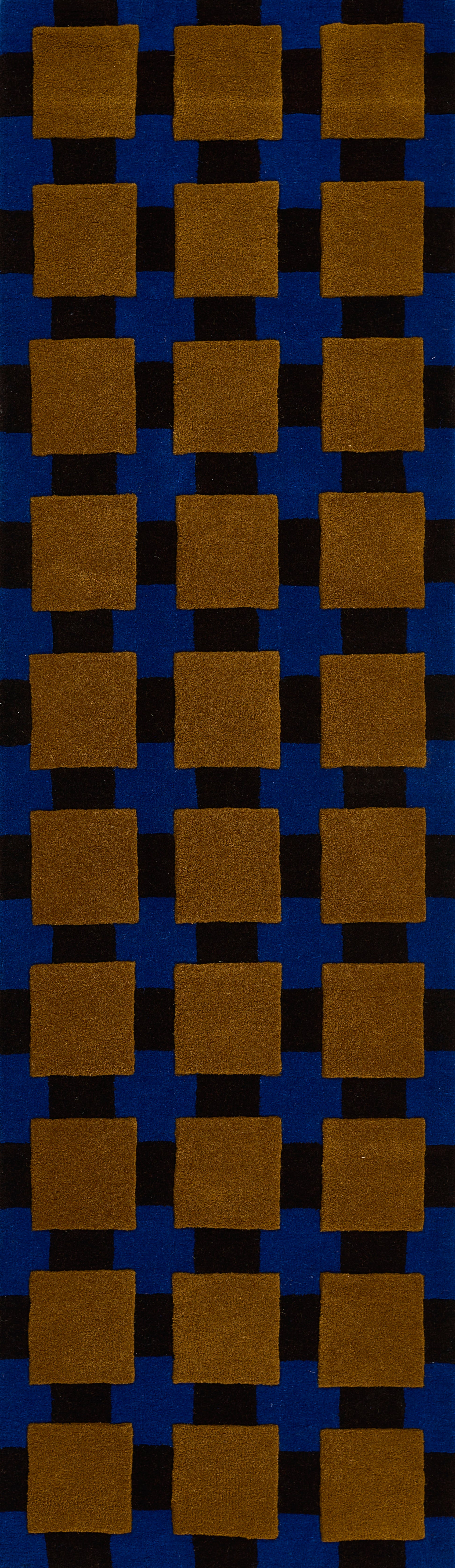 Orange-brown square tiles in a grid on a dark blue backdrop; bold geometric pattern.