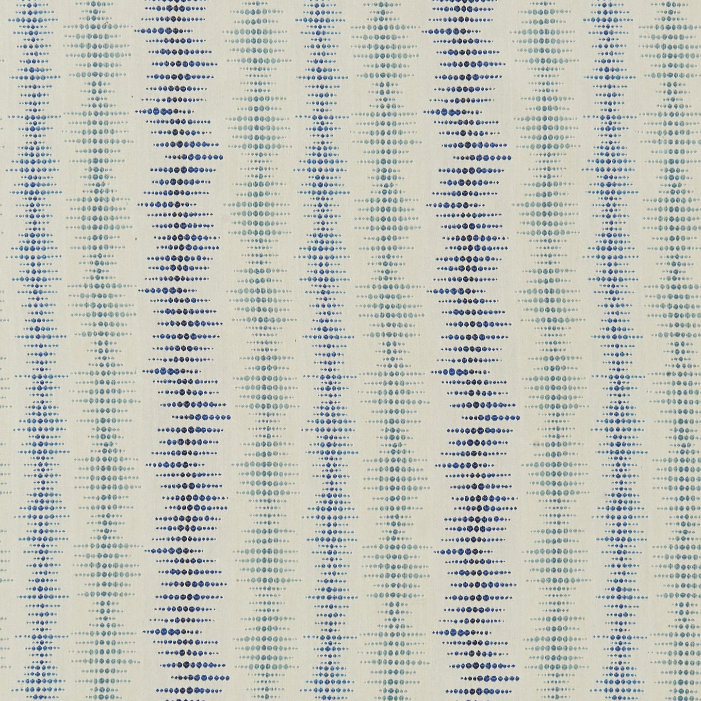 Cream fabric with vertical dotted blue zigzag stripes in navy & light blue, textile pattern for upholstery or curtains.