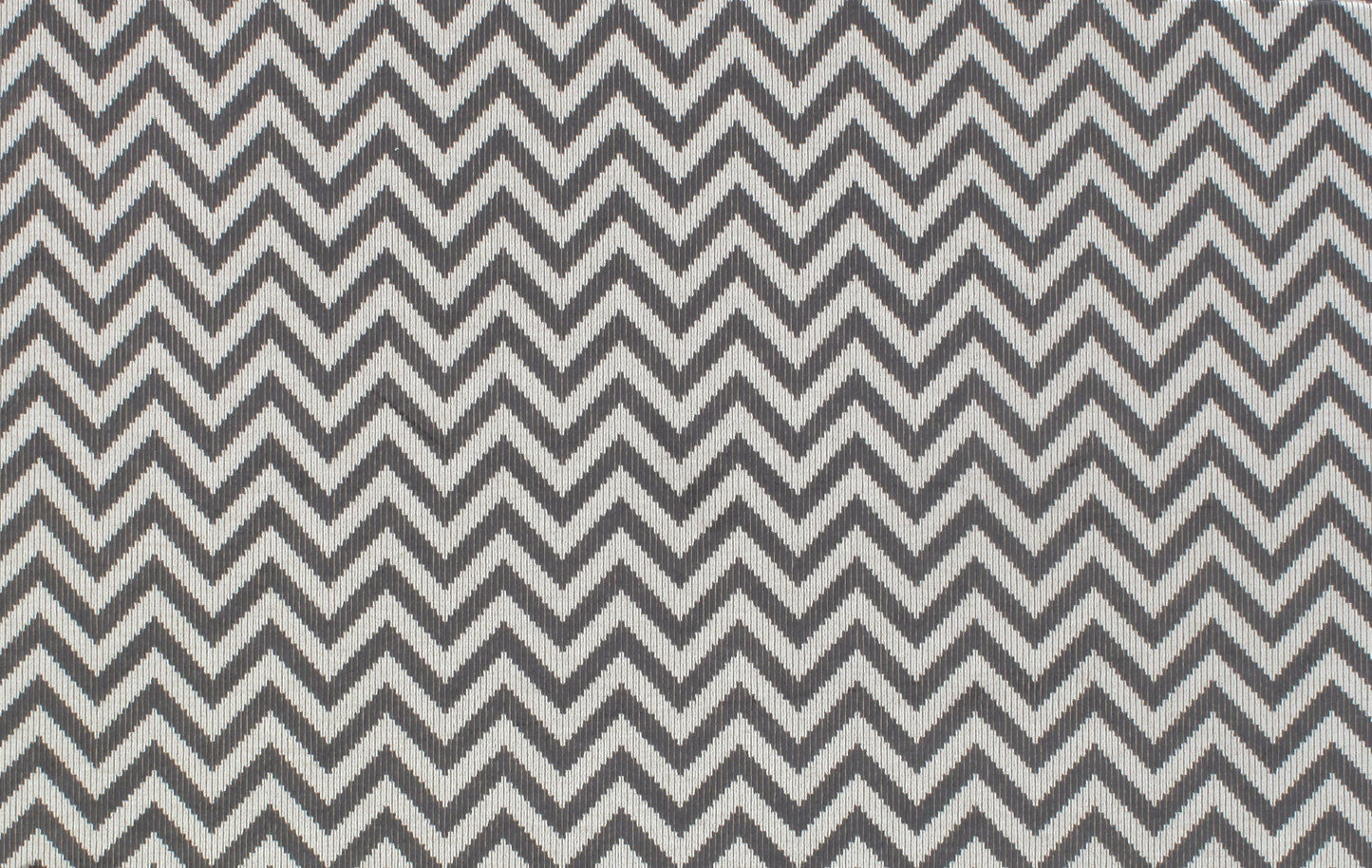 Grey & white chevron fabric with woven texture, modern zigzag pattern for upholstery or apparel.