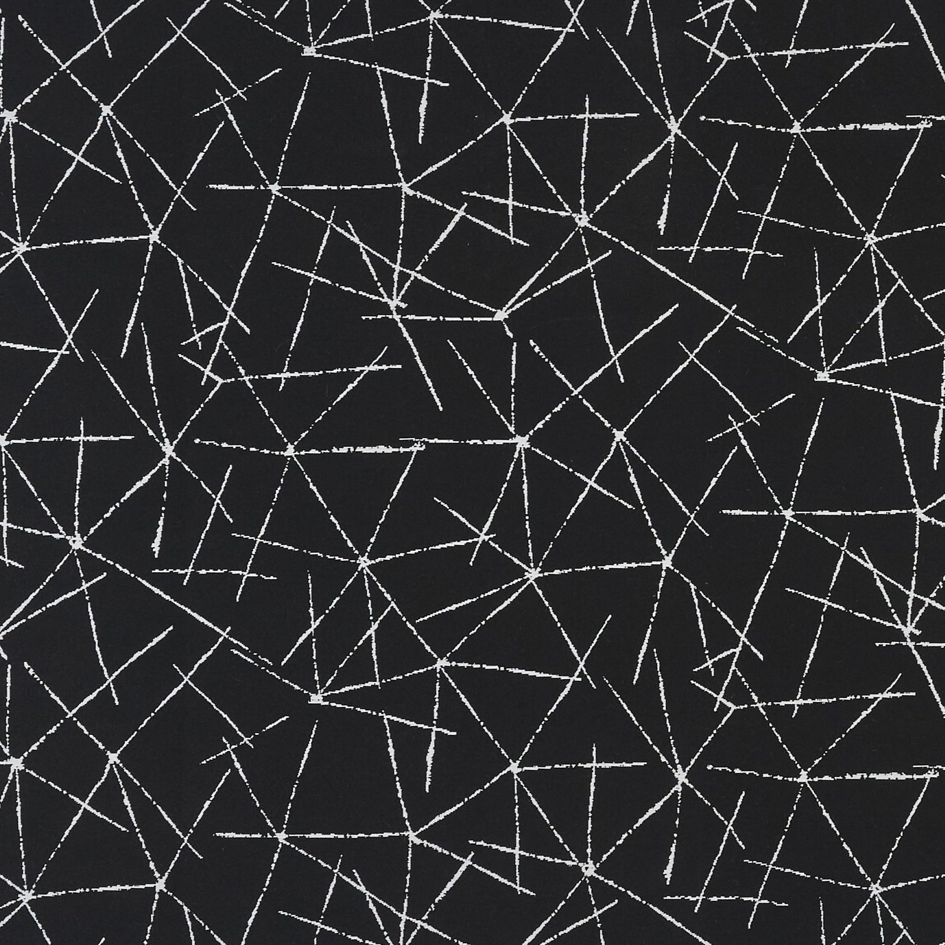 Charcoal gray fabric with white chalk-like fracture lines in an abstract geometric pattern.