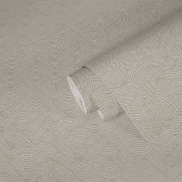 Beige wallcovering with interlocking circular swirl motif; close-up shows a folded edge.