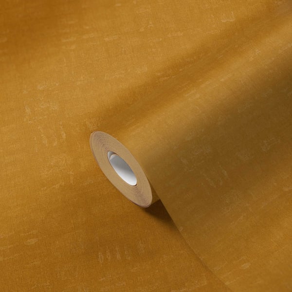 Beige linen-textured wallpaper roll on a matching sheet; curling edge reveals white cardboard core