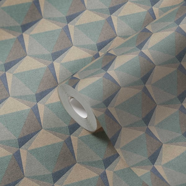 Geometric teal, blue, and beige triangle-pattern fabric with a gray masking tape roll resting on it.