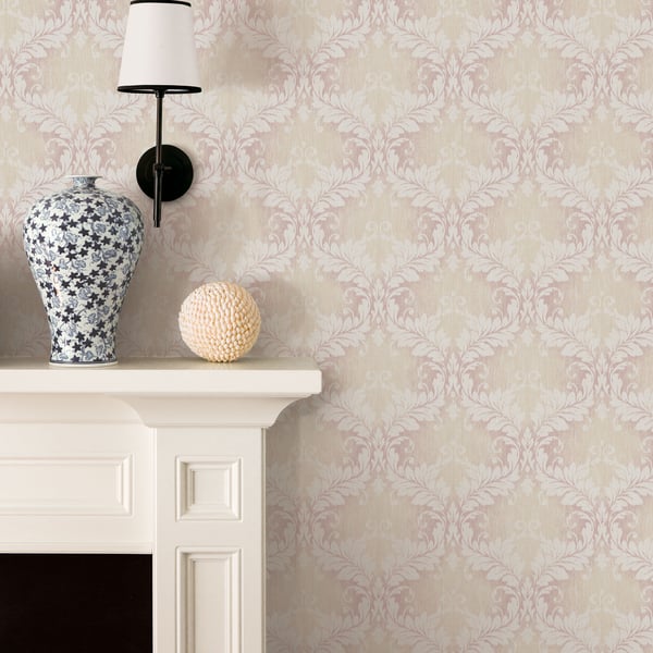 Pink embossed damask wallpaper.