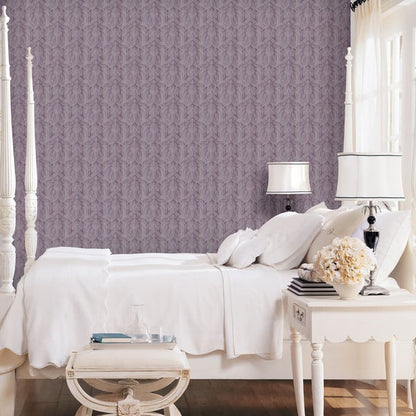 Purple lilac metallic damask wallpaper on the wall.