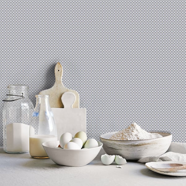 Gray patterned wallpaper featuring a kitchen still-life with eggs in a white bowl, flour in a ceramic bowl, a milk bottle, and wooden cutting boards.