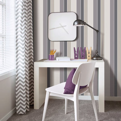 White desk and chair with a modern look, striped gray wall, black adjustable lamp, rounded square clock, purple organizers.